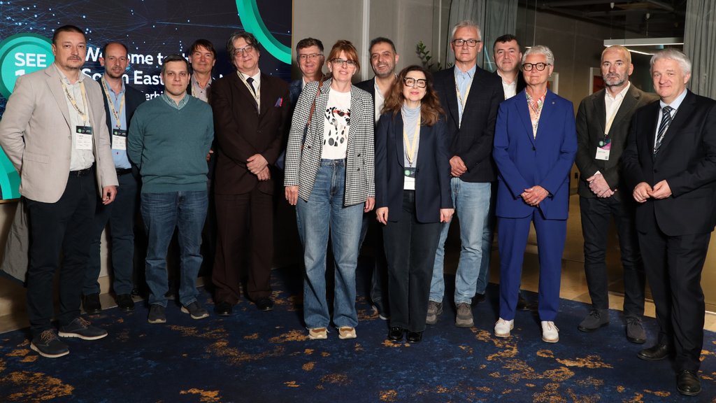 A group of people stand for a photo.